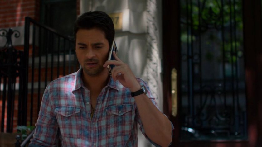 Oscar on the phone outside Sonia's Apartment.