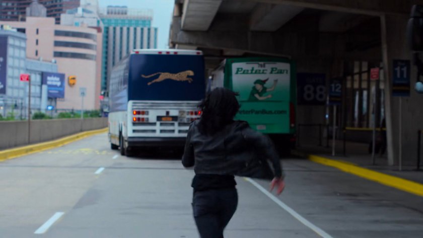 Jessica chasing after bus outside South Terminal Bus Depot.