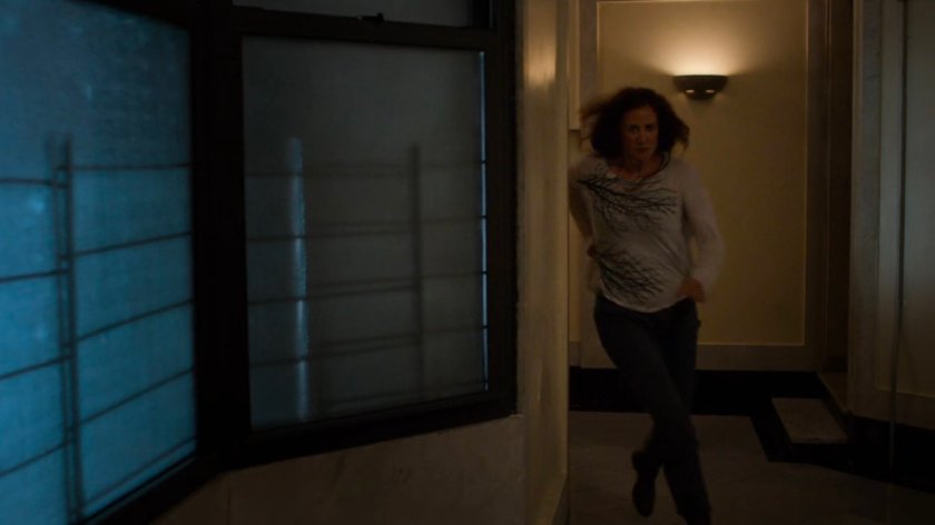 Alisa running through lobby of Alias Investigations building.