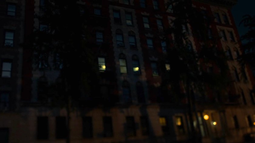 Front entrance to Alias Investigations building at night.