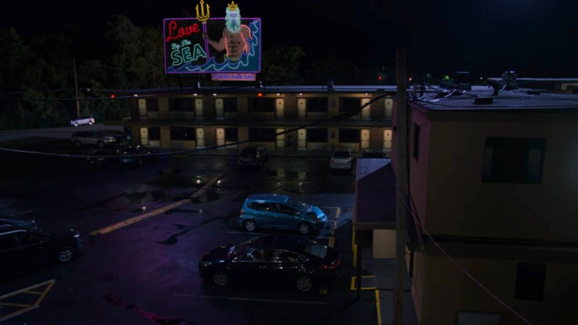 Nighttime exterior of the Love by the Sea Motel.