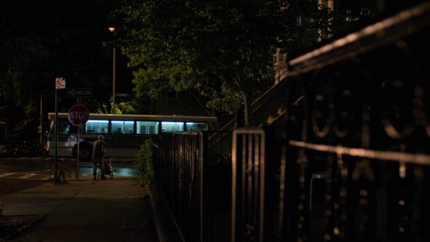 A bus at the corner by Holiday's house.