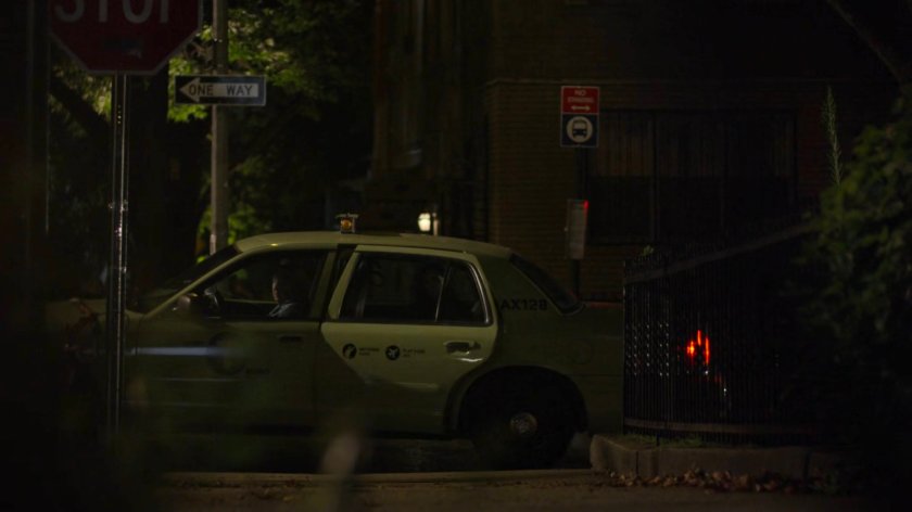 A cab pulls up to the corner outside Holiday's house.
