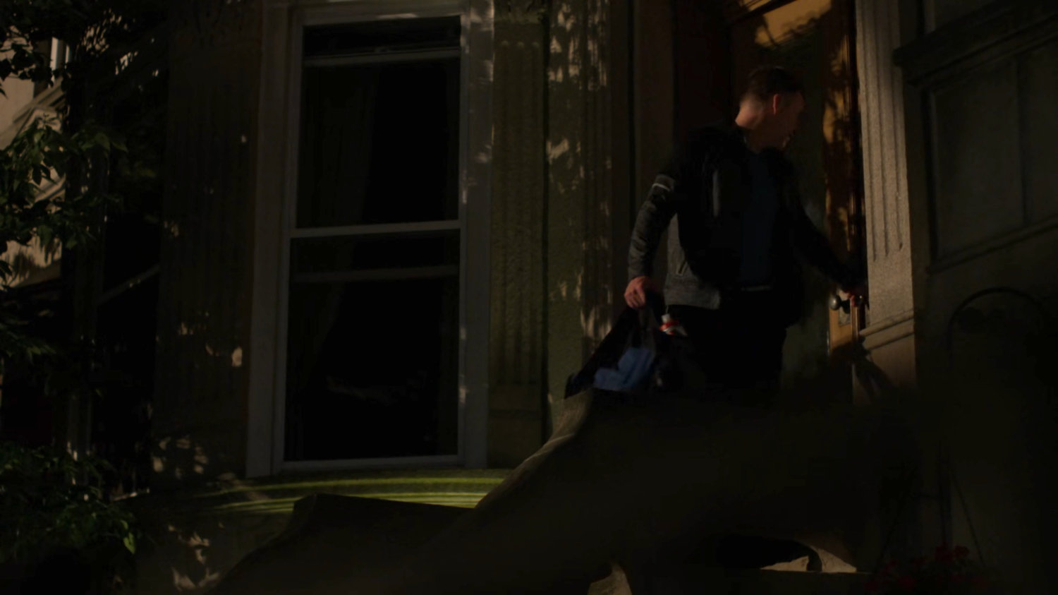 Holiday leaving his house at night.