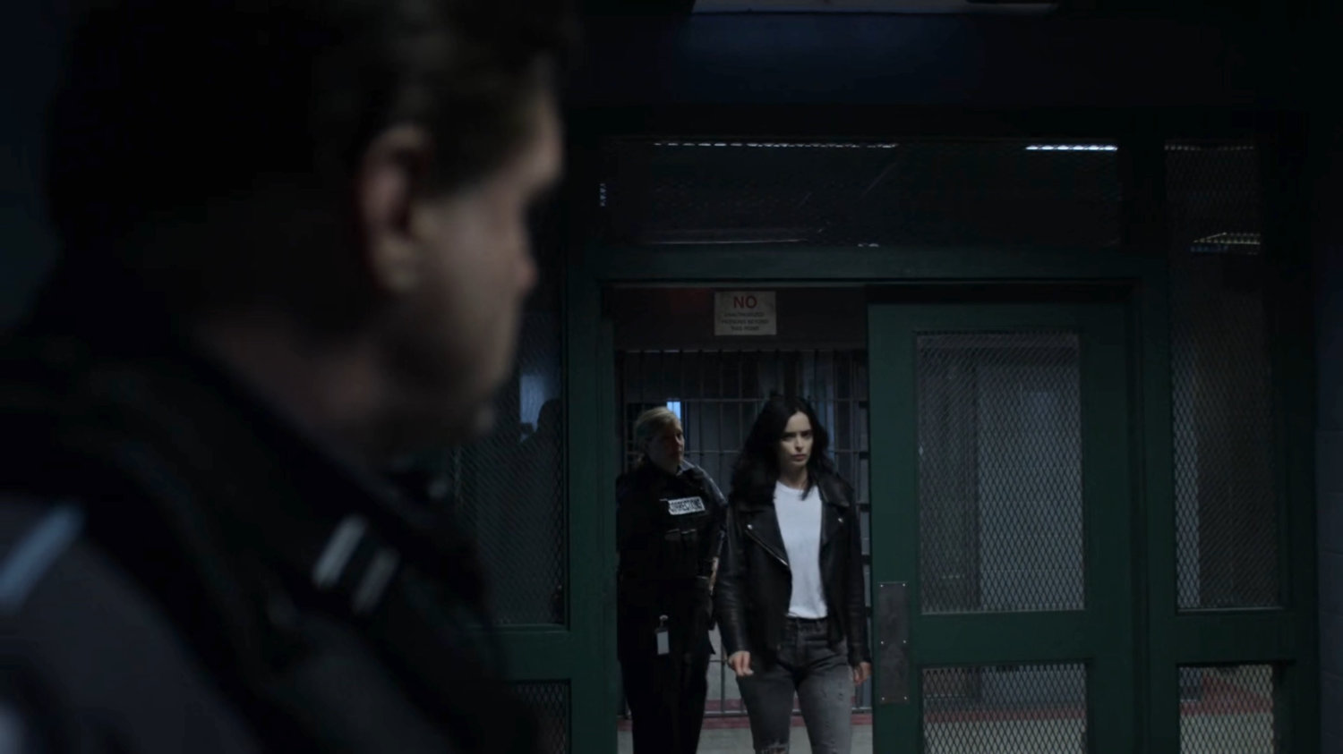 Jessica walking through a door at Eastern Regional Detention Center.