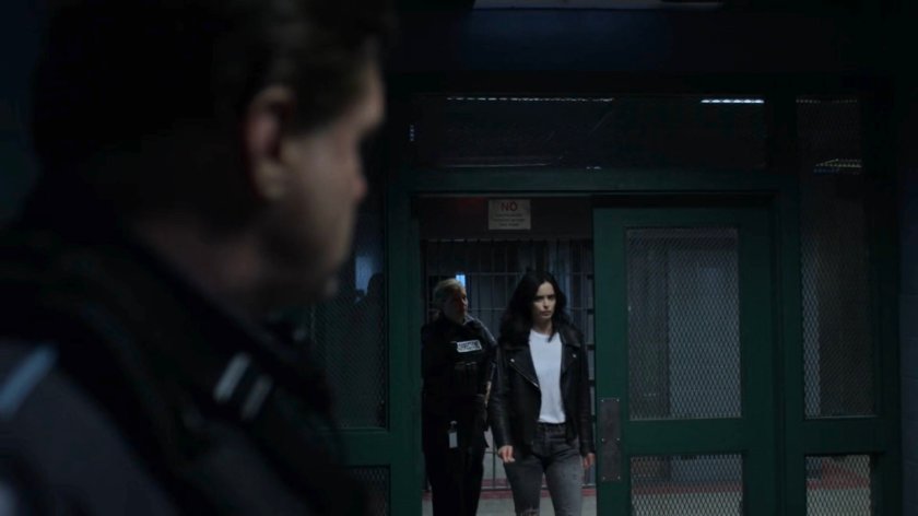 Jessica walking through a door at Eastern Regional Detention Center.