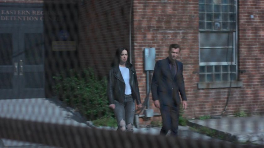 Jessica and Kilgrave walking outside Eastern Regional Detention Center.