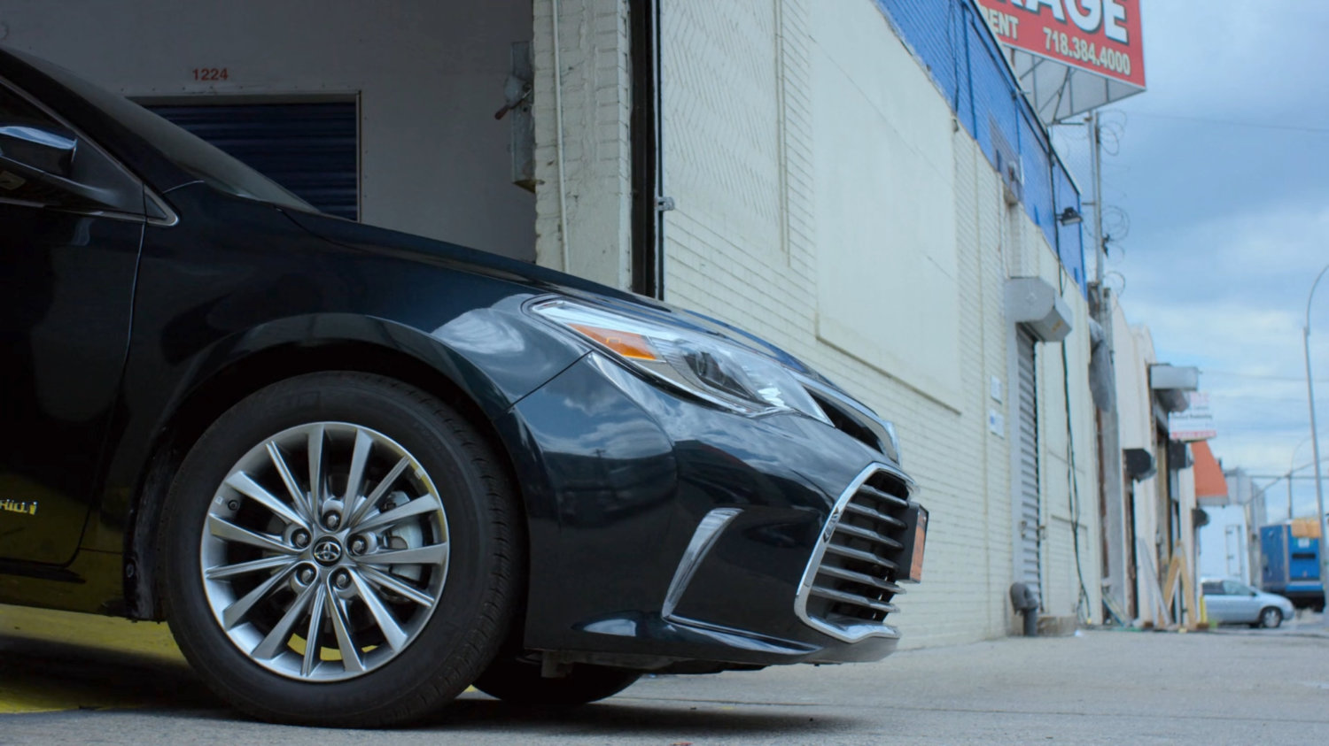 Trish's car leaving a storage facility.