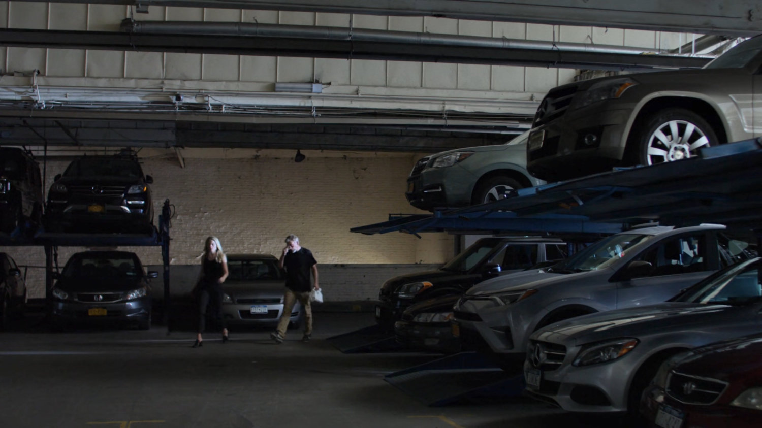 Trish and Karl in a parking garage.