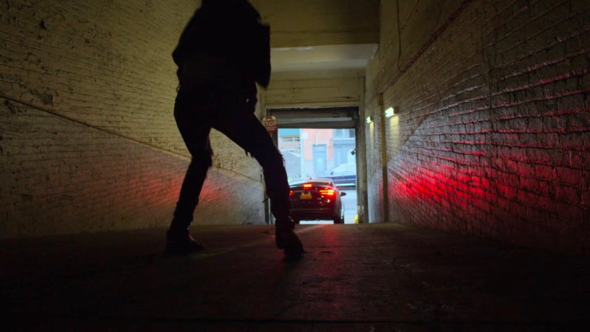 Jessica chasing Trish's car in a parking garage.