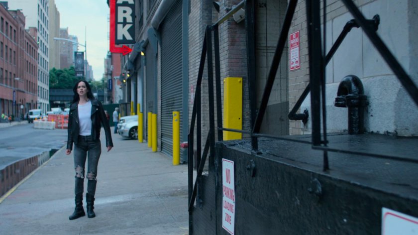 Jessica outside a parking garage.