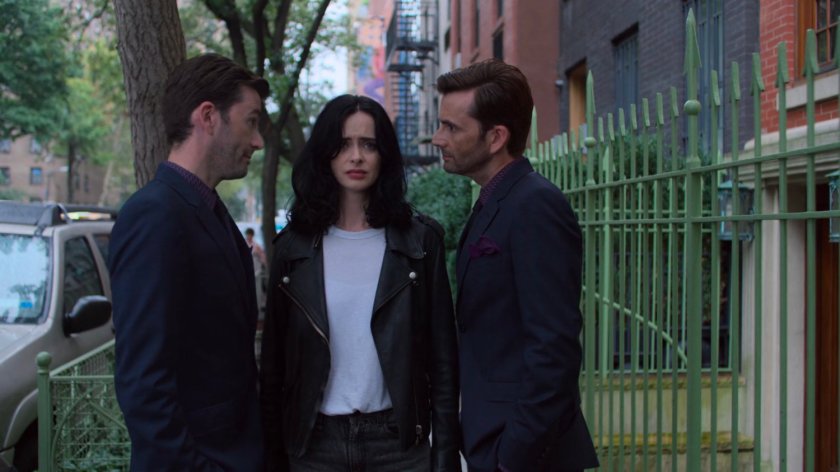 Jessica and two Kilgrave's on a sidewalk.