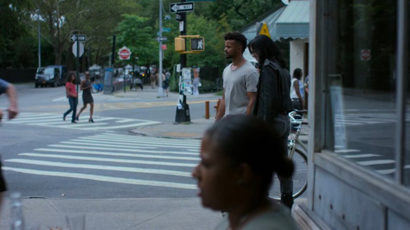 Malcolm and Jessica on a corner sidewalk.