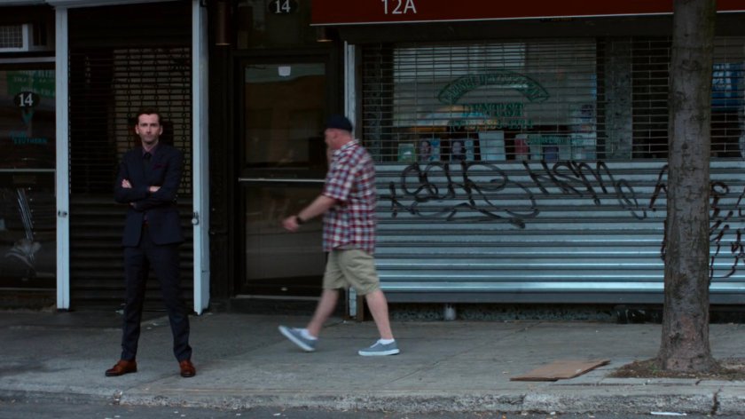 Kilgrave on the sidewalk.