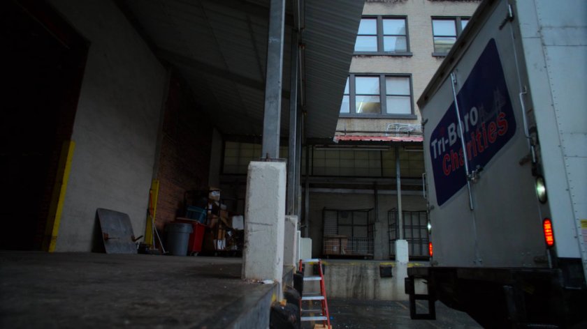 Truck backing up to a loading dock.