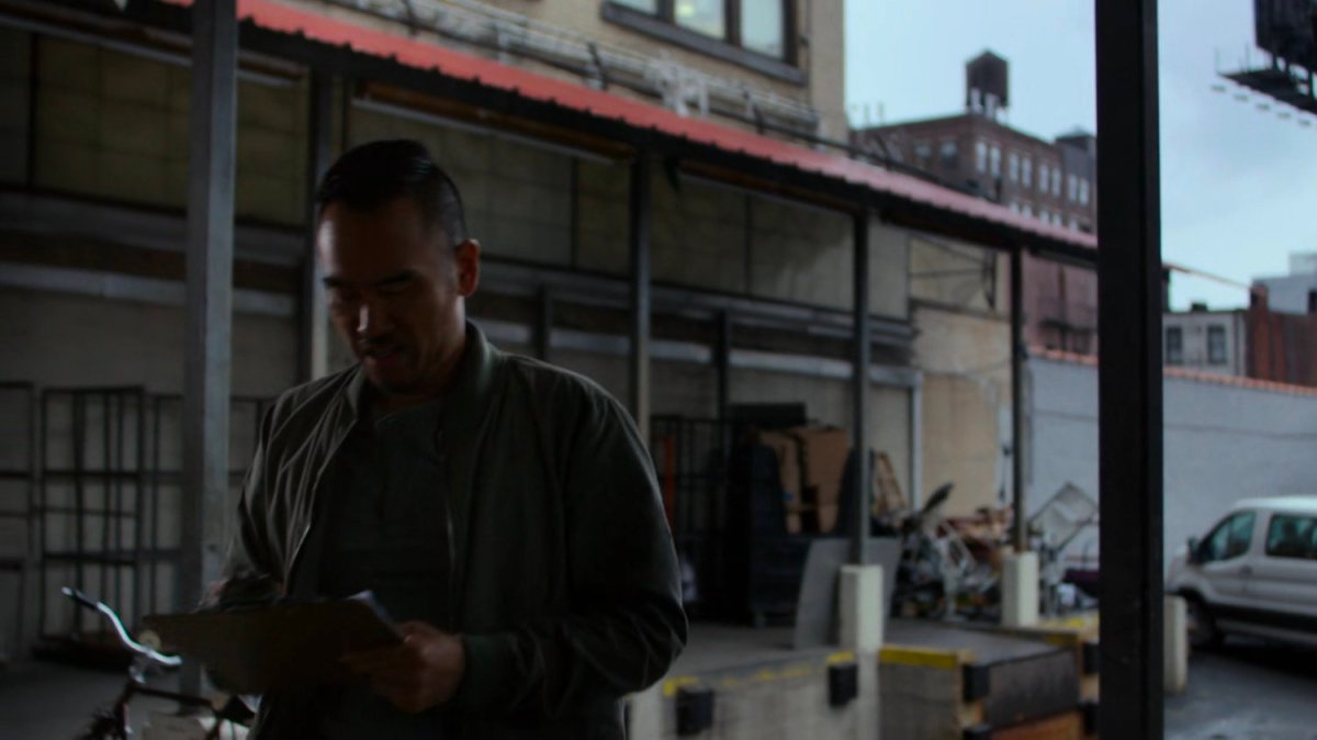 Supervisor standing on a loading dock.