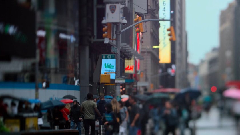 Pedestrians walking around Times Square.