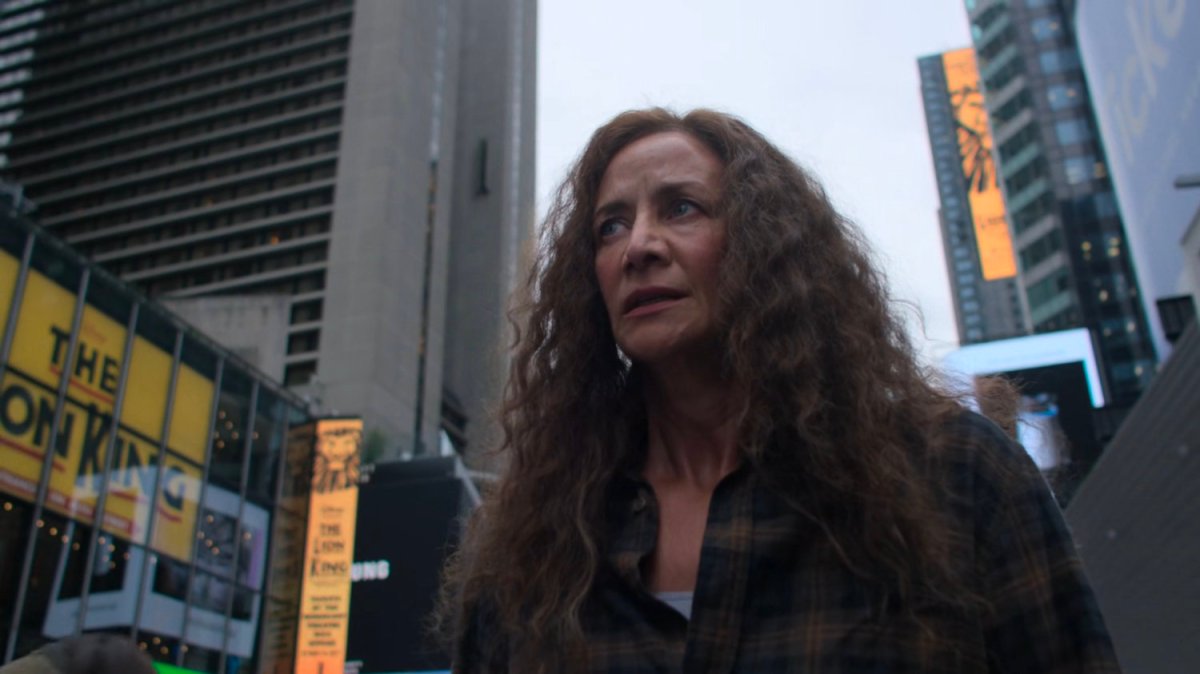 Alisa walking through Times Square.