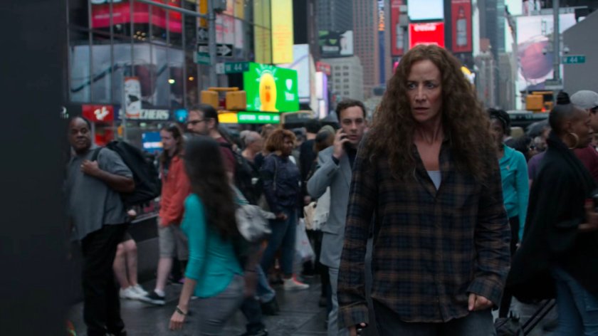 Alisa walking through Times Square.