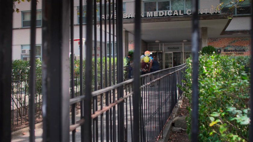 Dorothy and news reporters outside the Riverbank Medical Center.