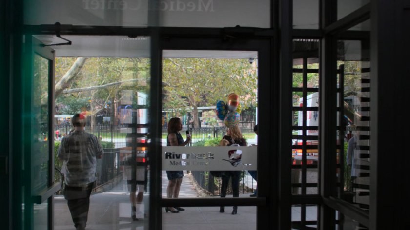 Dorothy and news reporter outside the Riverbank Medical Center.