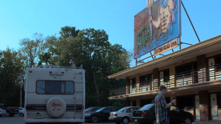 RV in the parking lot of the Love by the Sea Motel.