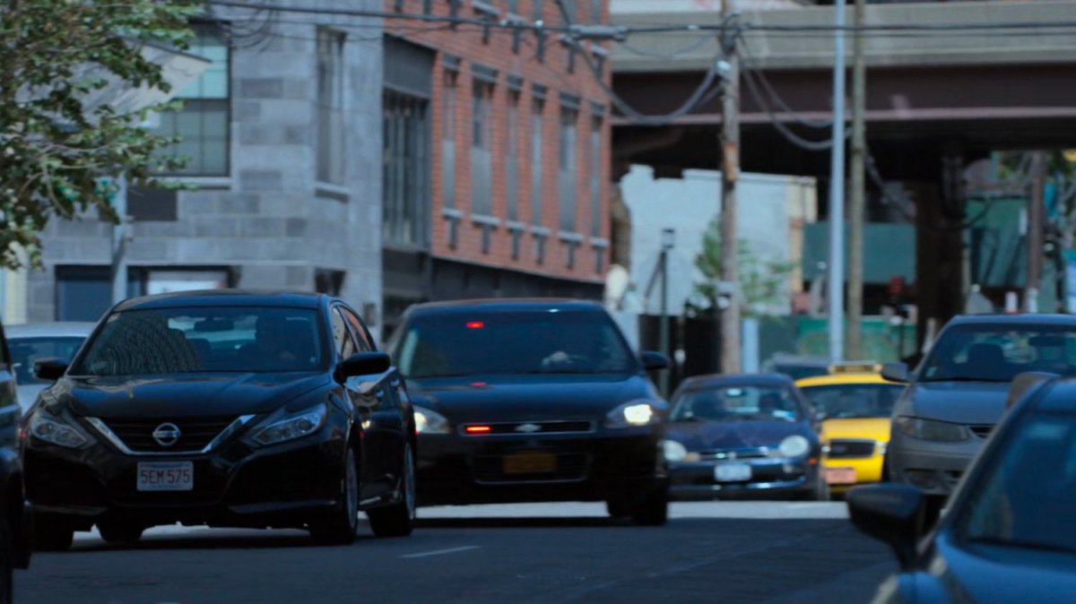 Detective Costa's car speeding through traffic.