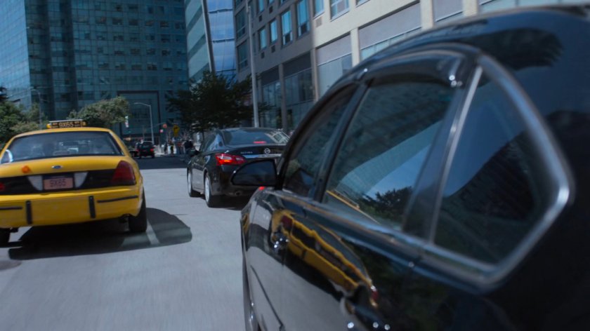 Detective Costa's car speeding through traffic.