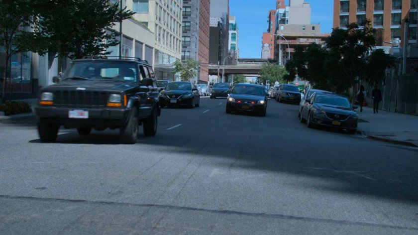 Detective Costa's car speeding through traffic.
