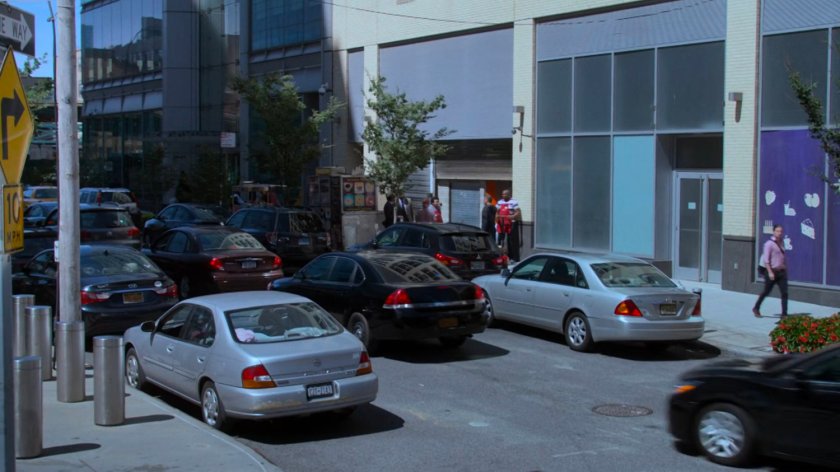 Detective Costa's car stuck in traffic.