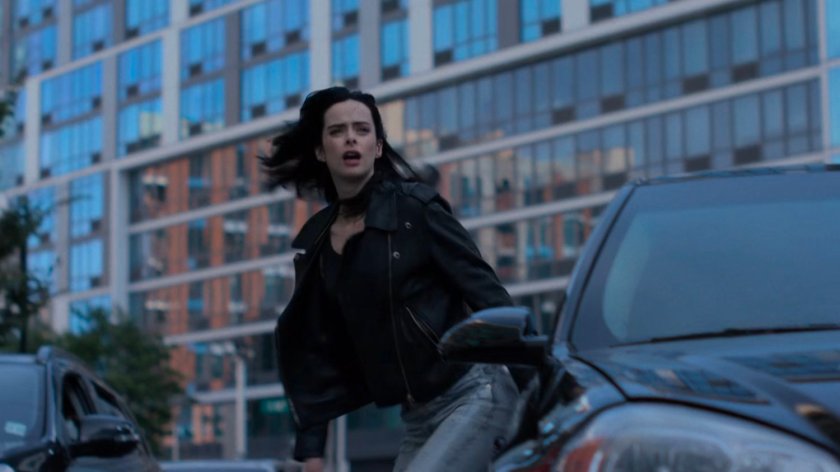 Jessica jumping out of Detective Costa's car.