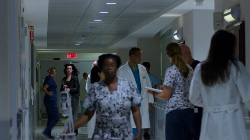 Jessica running through a hall of the Riverbank Medical Center.
