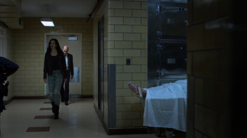 Jessica and Detective Costa walking through the Riverbank Medical Center morgue.