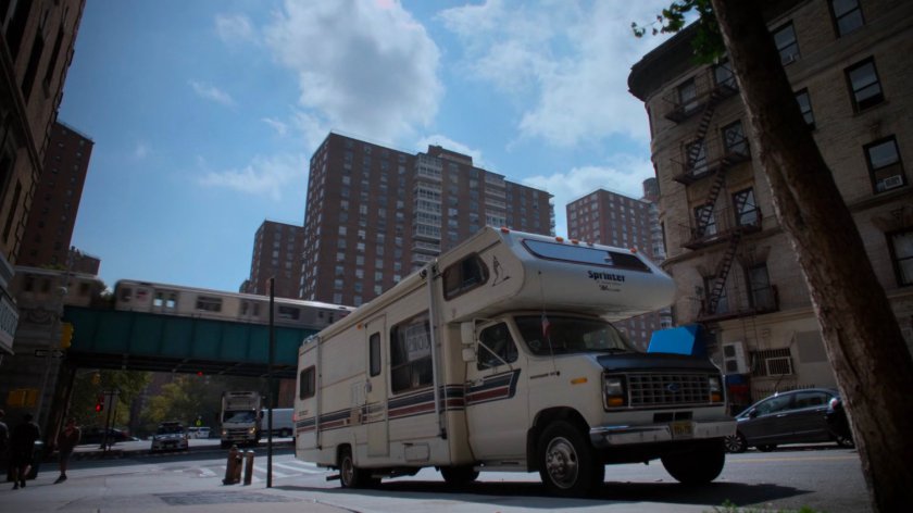 Alisa's RV parked outside the Alias Investigations building.