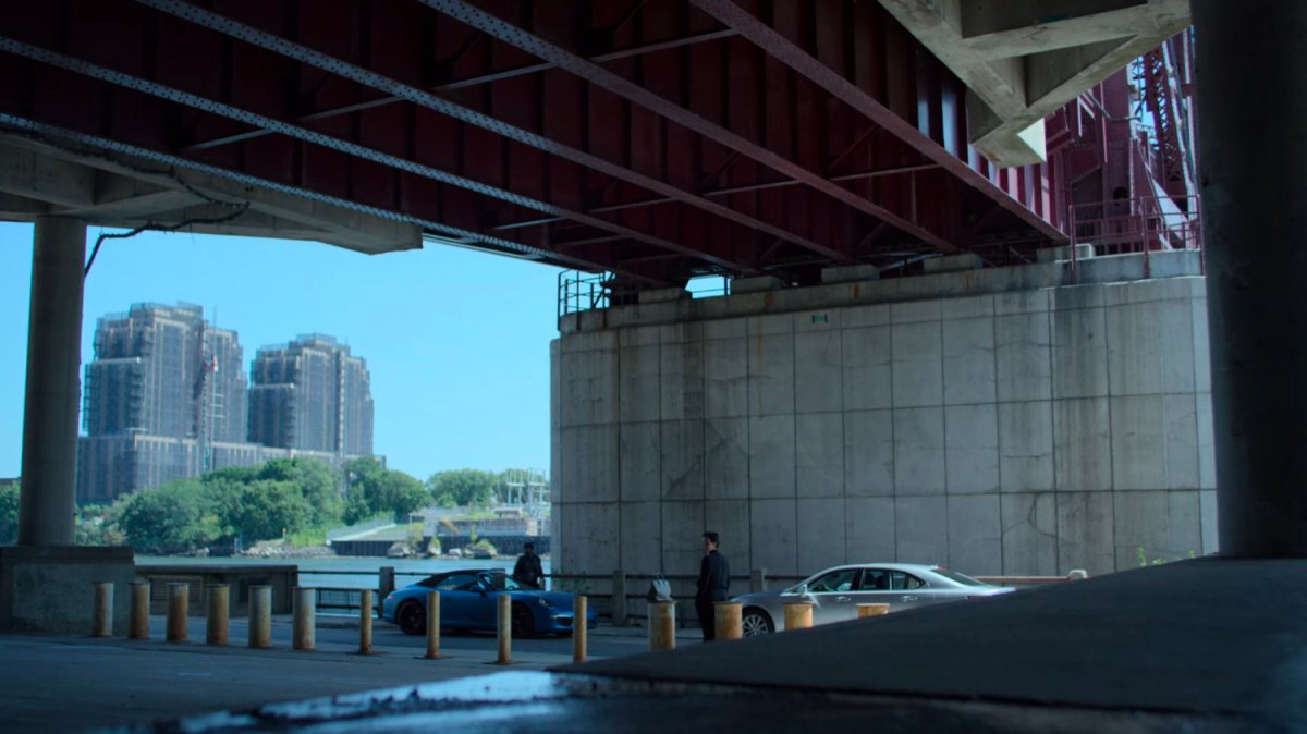 Jeri meeting with Turk under a bridge.