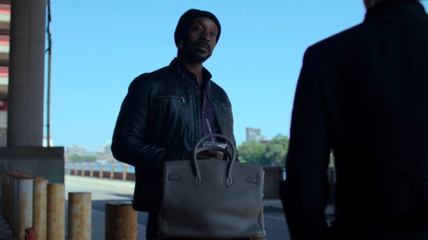 Jeri meeting with Turk under a bridge.