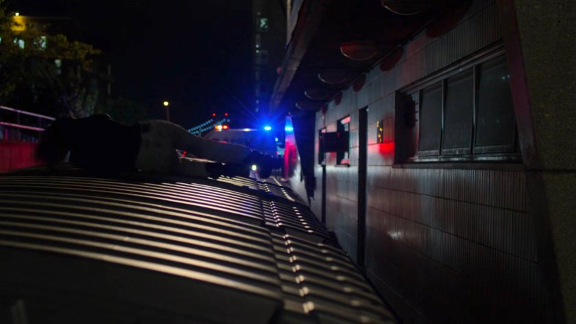 Jessica on a trash dumpster outside Riverbank Medical Center.