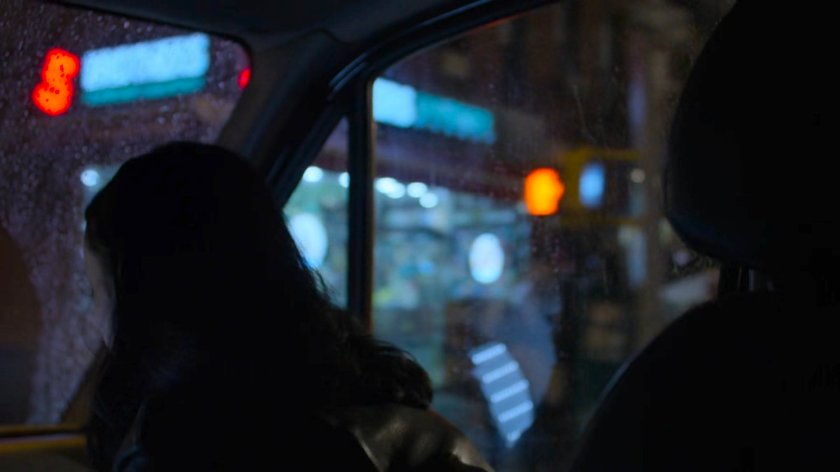 Jessica pulling up outside Trish's apartment building in a mortuary van.