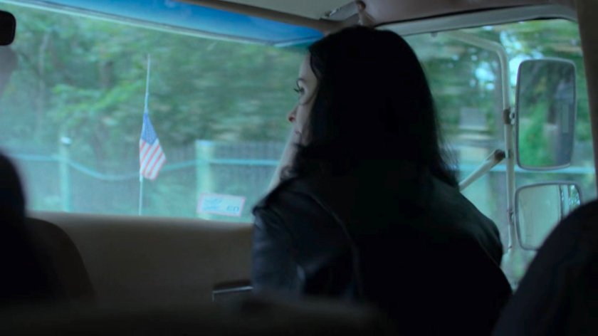 Jessica and Alisa driving along a Westchester road.