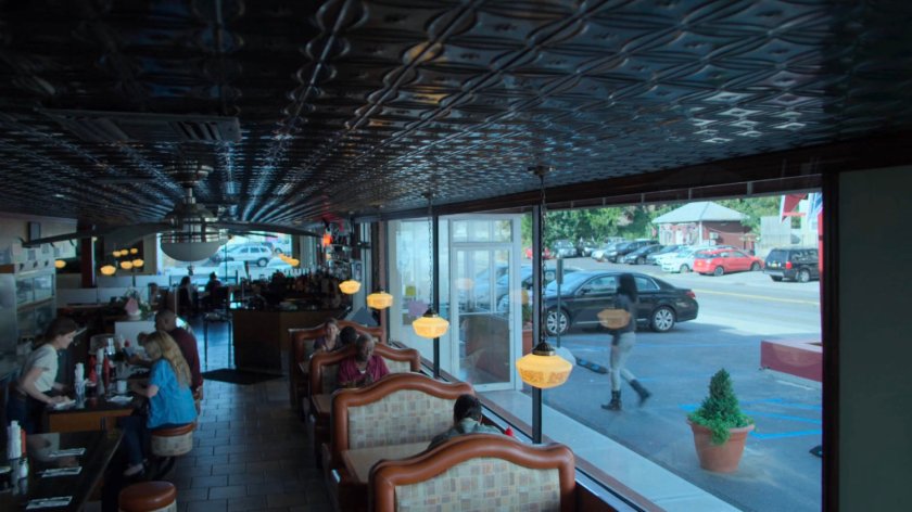 Jessica entering a Truck Stop Diner.