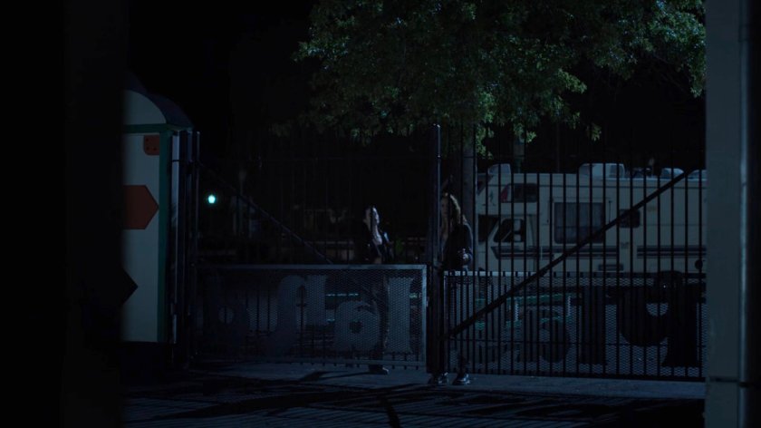 Alisa and Jessica outside Playland amusement park at night.