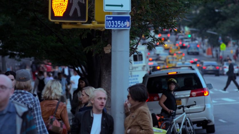 Jessica on a busy sidewalk.