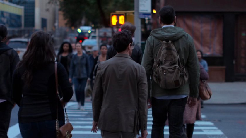 Pedestrians crossing a busy intersection.