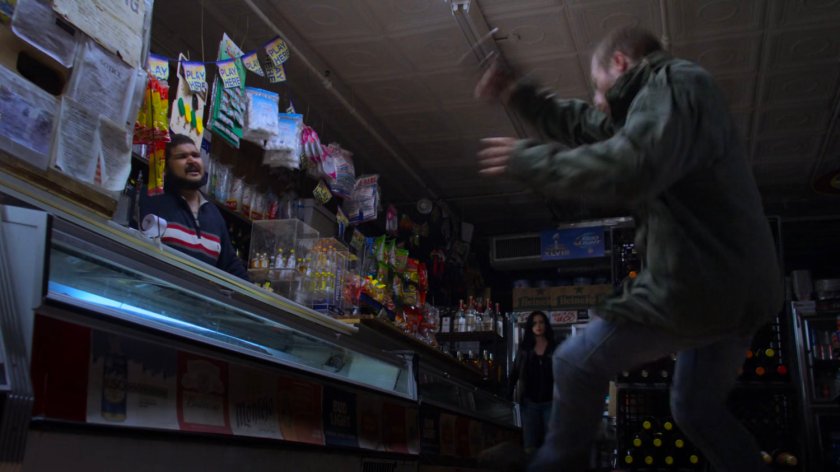 Jessica throws a bottle at a robber in Sonny's Grocery.