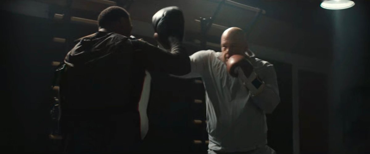 Fisk boxing his trainer at the gym.