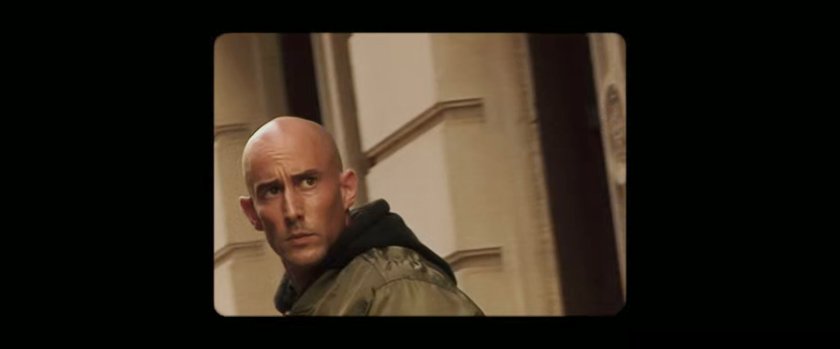 Fisk Report: Bald man on sidewalk.