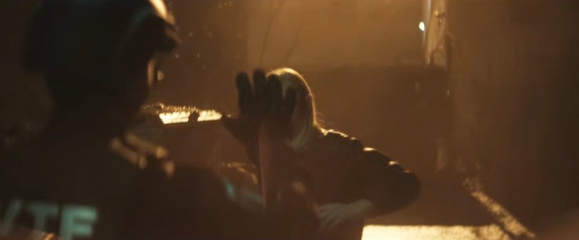 Karen punching out an AVTF officer in the alley behind Josie's bar.