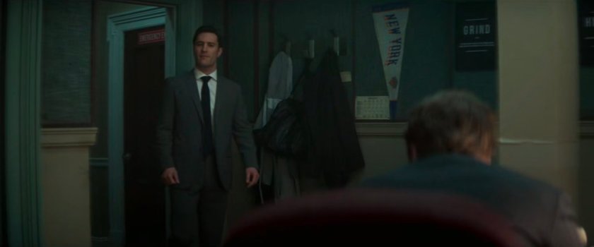Buck entering Daniel's office.