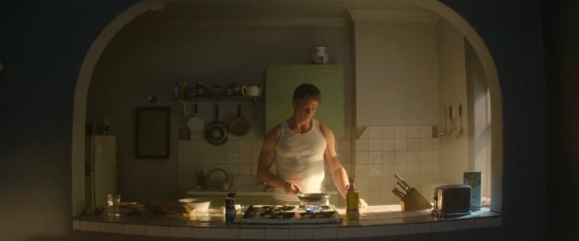 Dex preparing breakfast in his kitchen.