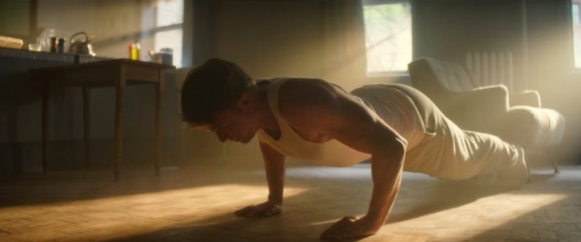 Dex doing pushups in his living room.